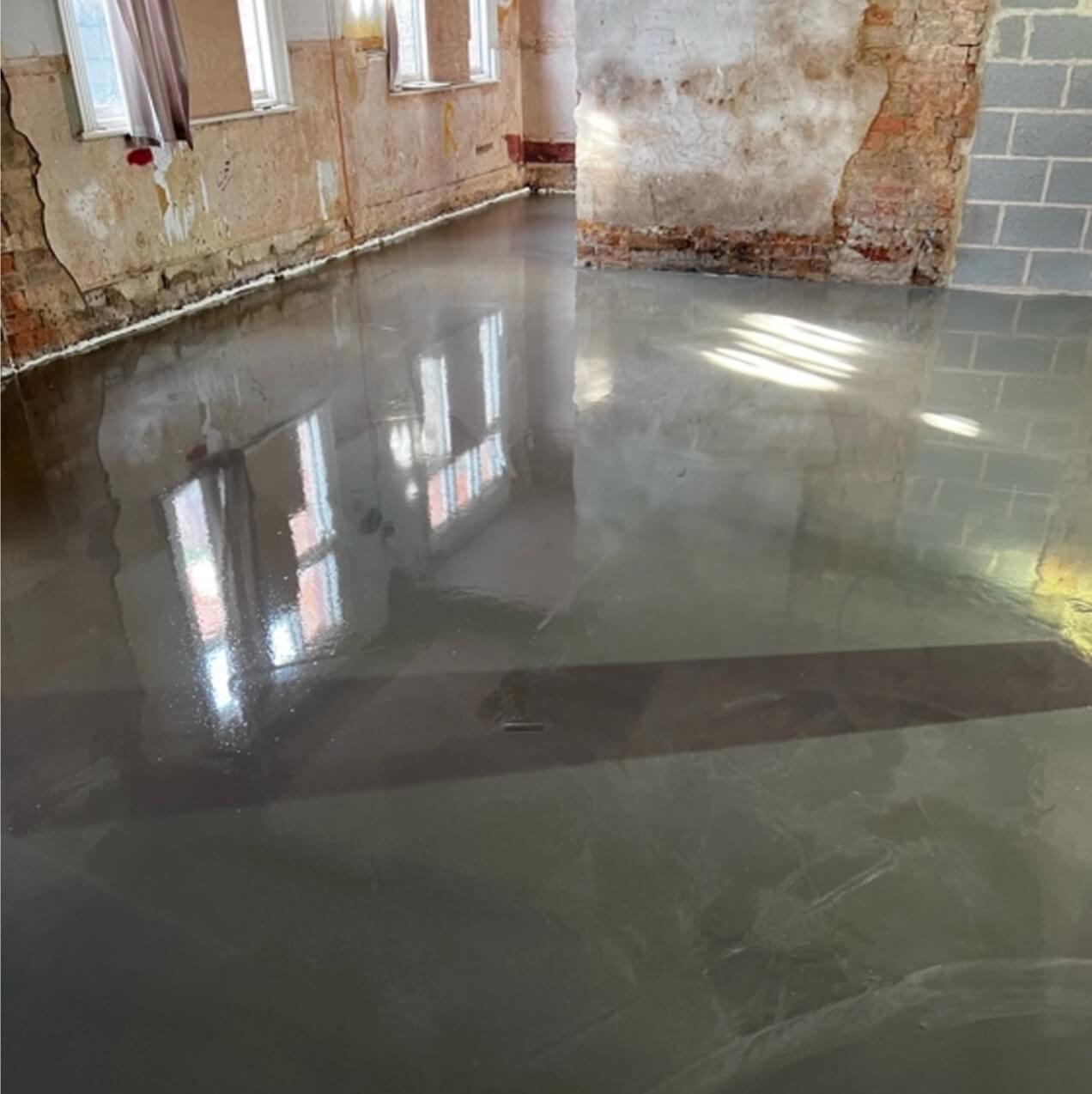 Self leveling compund being installed throughout a pub renovation, in some areas it reaches depths of 50mm to gain the correct levels